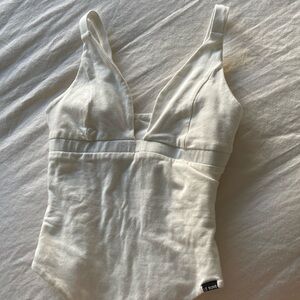 Le buns white bodysuit
